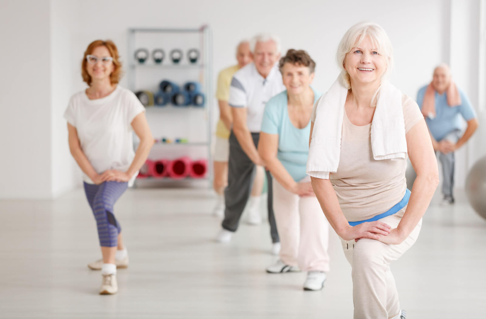A group of seniors exercising in a senior living facility.
