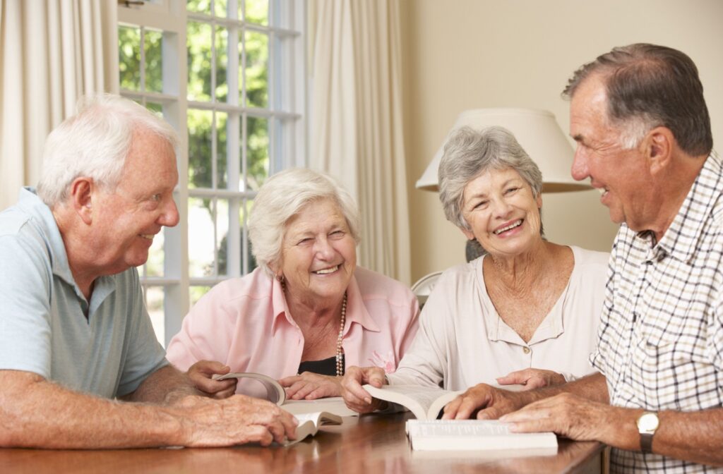 A group of seniors discusses the book they're reading during a regular book club meeting.